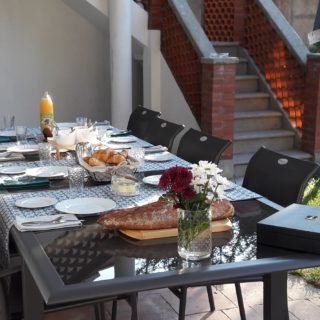 Breakfast served on the terrace with bread, croissants and Tarn et Garonne fruit juice