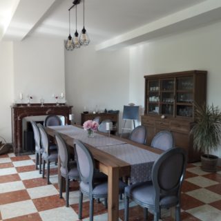 Dining room with beautiful marble fireplace, a mix of the old and the modern