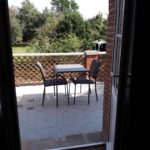 Fire Suite private terrace with table and chairs and beautiful garden view