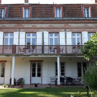 The guest house and its terraces overlooking the garden