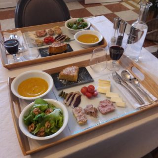 Gourmet platter with soup, delicatessen, cheese and dessert