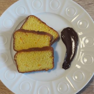 Soft orange cake with chocolat sauce as a dessert