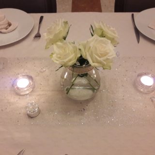 Refined table setting with flowers for table d’hotes dinner