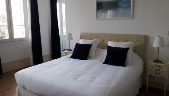 Very comfortable king size bed in the suite Water with soft pillows, nice photo frame evoking water