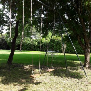 Nice swing to relax in the park of the bed and breakfast