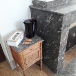 Small table by the fireplace with kettle, biscuits, tea and coffee facilities